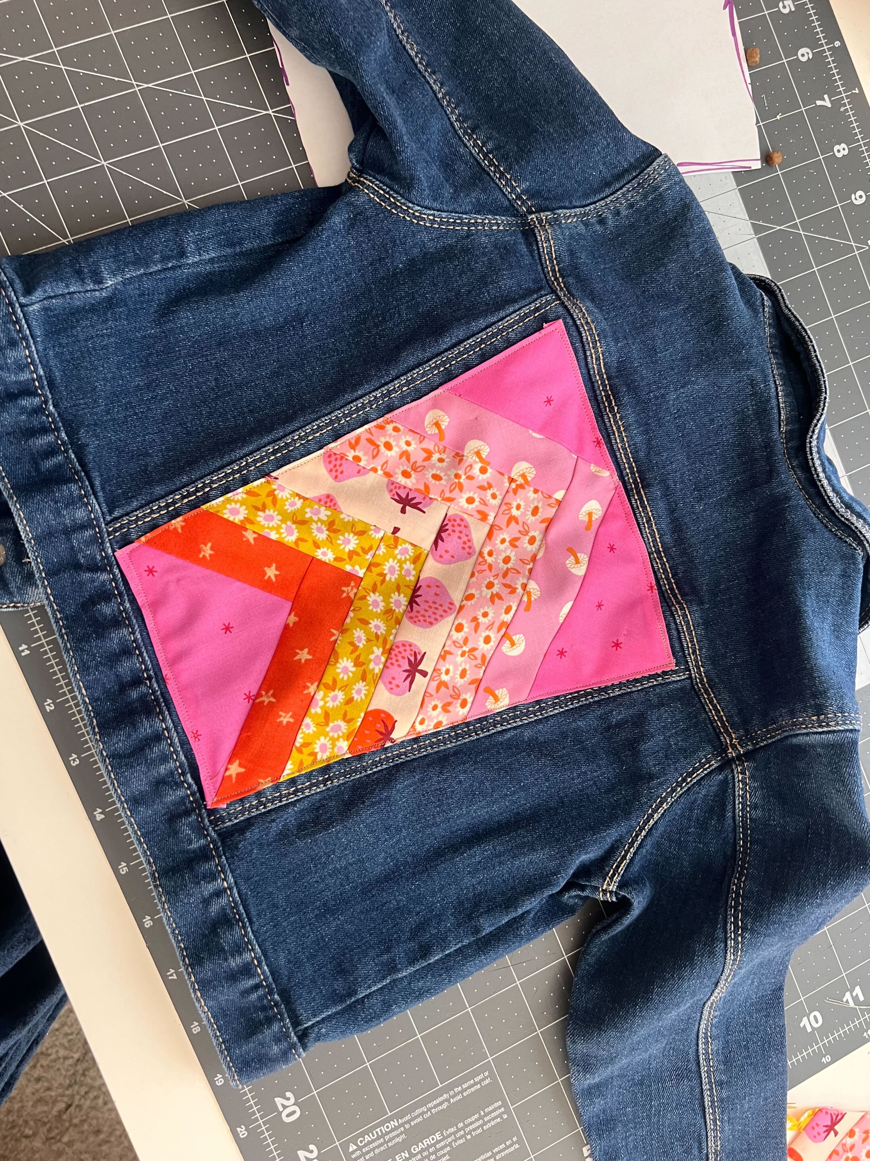 Jean jacket with quilted back.